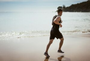 a man running on a beach